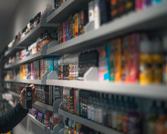 person standing in front of a shelf in a shop