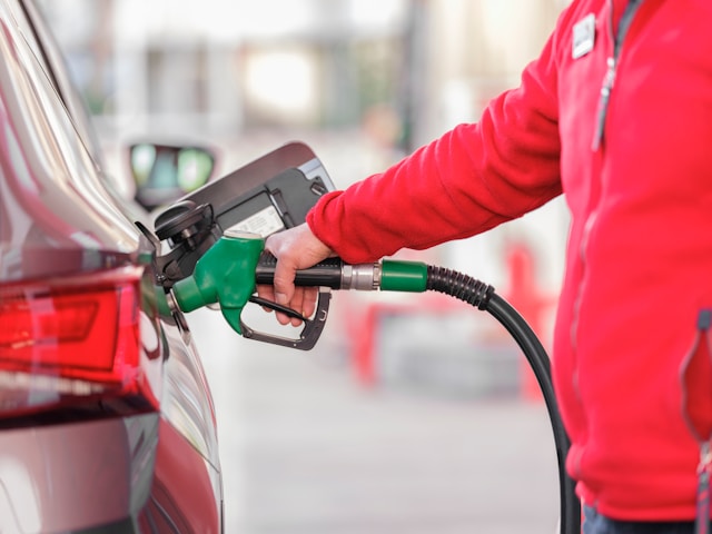 person filling a car with fuel