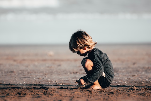 girl playing on the beach