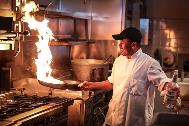 a chef cooking in a commerical kitchen