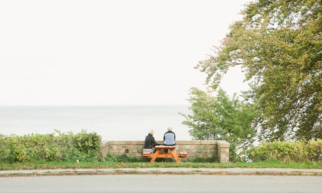 A couple sitting by the river