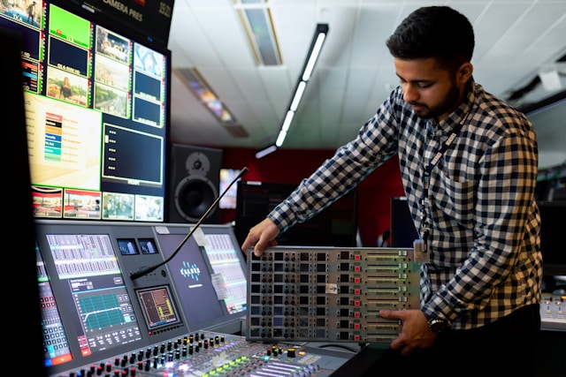 man installing sound desk